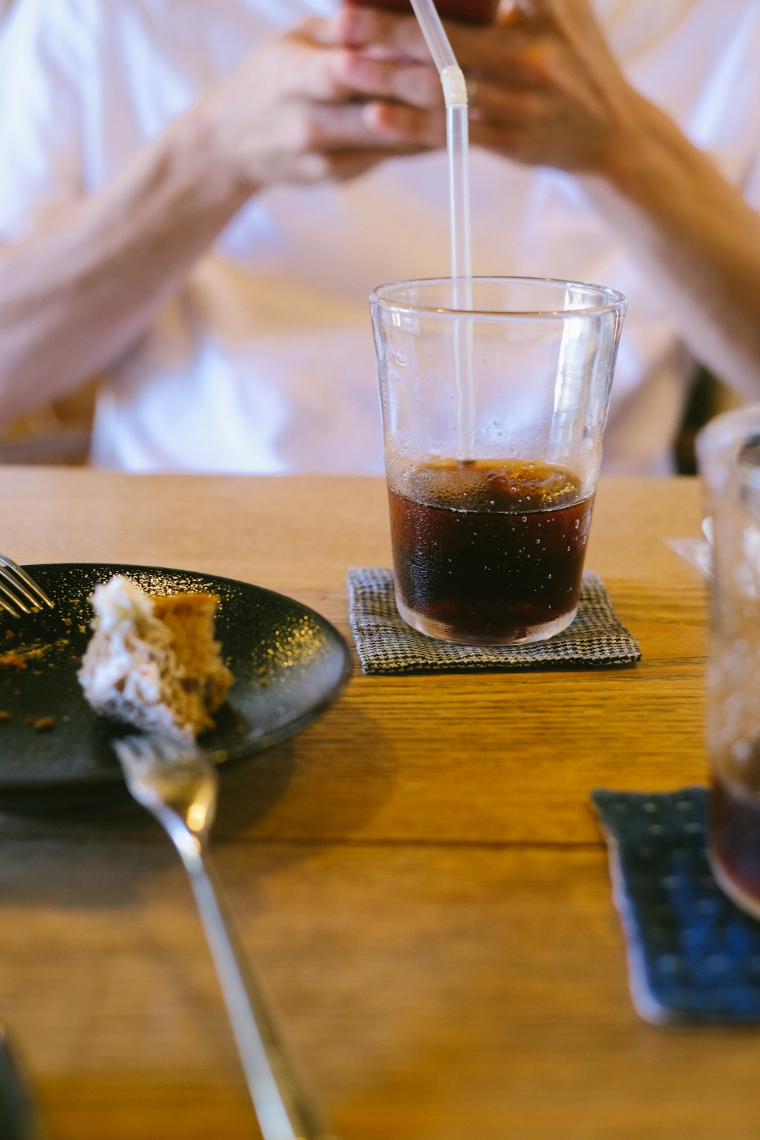 a-person-sitting-at-a-table-with-a-plate-of-food-qp6ppo6evji