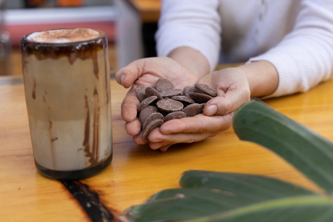 Warm beverage served with chocolate, captured in a cozy indoor setting, enhancing the mood of a perfect start to the day.